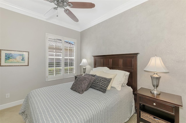 bedroom featuring ornamental molding, light carpet, and ceiling fan