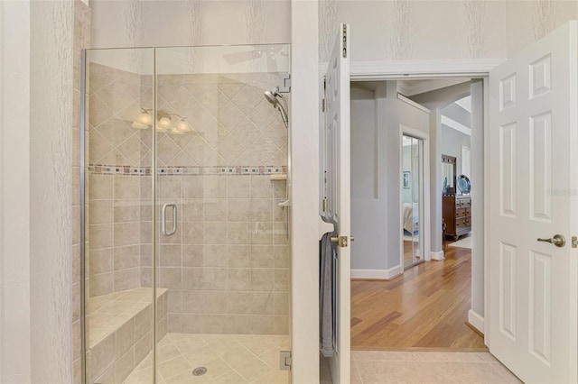 bathroom featuring tile patterned floors and an enclosed shower