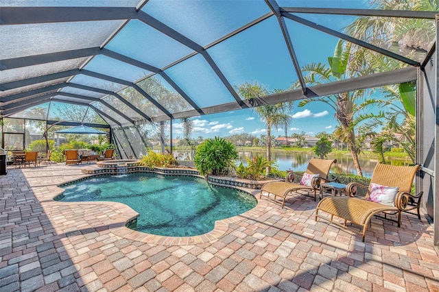 view of pool with a water view, an in ground hot tub, a lanai, and a patio area