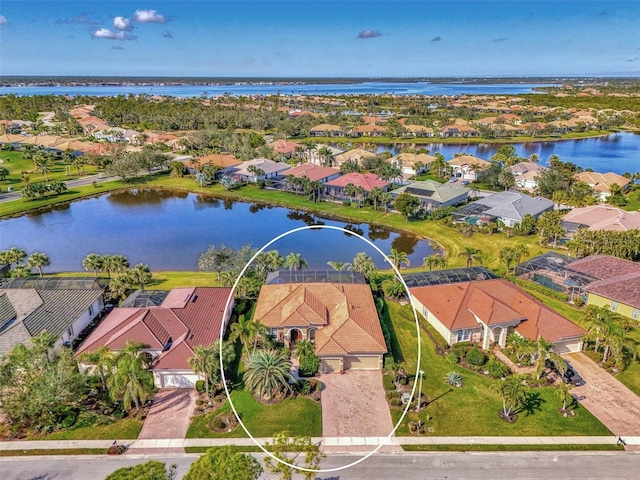 birds eye view of property featuring a water view