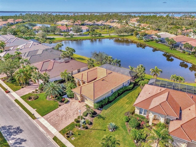 birds eye view of property with a water view