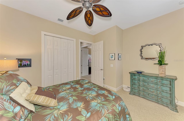 bedroom with ceiling fan, carpet flooring, and a closet