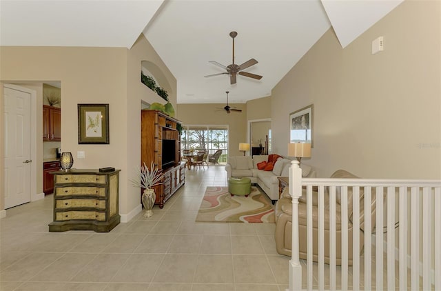 living room with light tile patterned floors, high vaulted ceiling, and ceiling fan