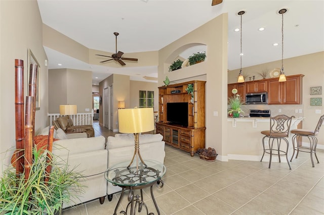 living room with ceiling fan and light tile patterned flooring