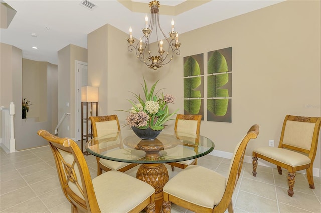 tiled dining space featuring a notable chandelier