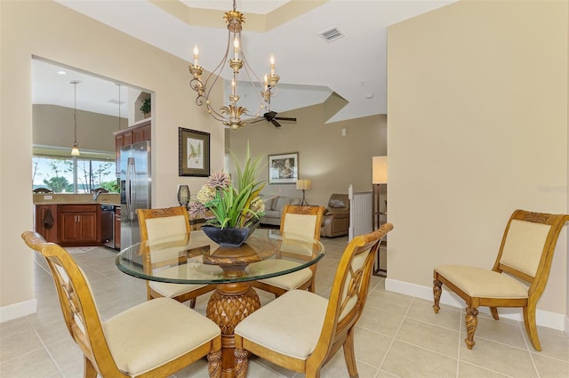 dining area with light tile patterned floors and a chandelier