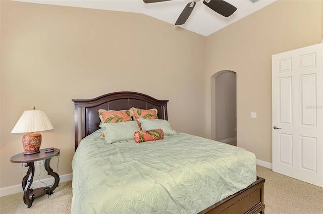 bedroom featuring ceiling fan, lofted ceiling, and light carpet