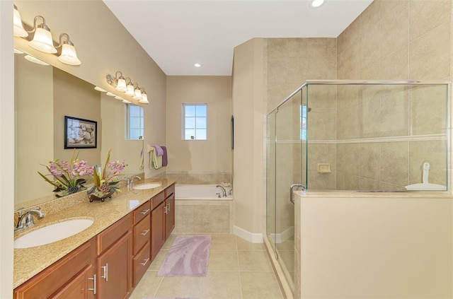 bathroom with tile patterned floors, independent shower and bath, and vanity