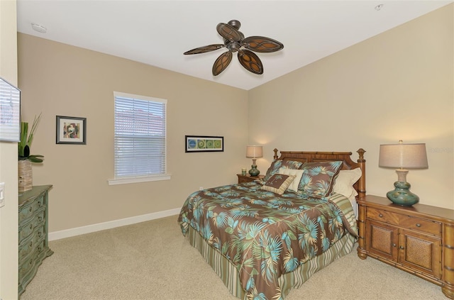 bedroom featuring light carpet and ceiling fan