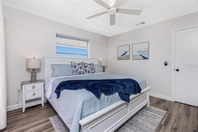 bedroom with dark wood-type flooring and ceiling fan