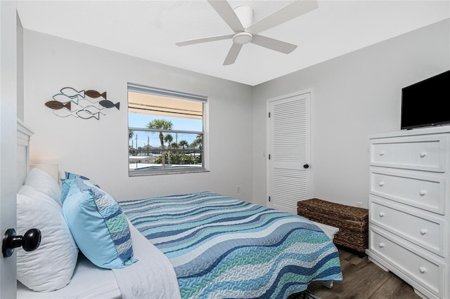 bedroom featuring ceiling fan and dark hardwood / wood-style floors