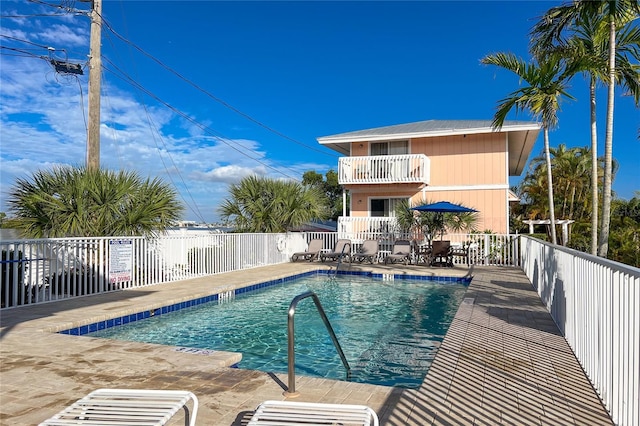 view of swimming pool with a patio area