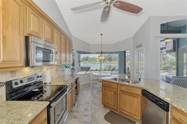 kitchen featuring sink, appliances with stainless steel finishes, backsplash, light stone counters, and vaulted ceiling