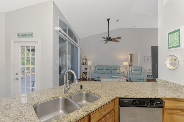 kitchen featuring high vaulted ceiling, dishwasher, sink, ceiling fan, and light stone countertops