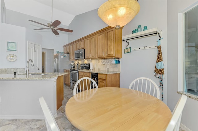 dining room with ceiling fan, high vaulted ceiling, beverage cooler, and sink