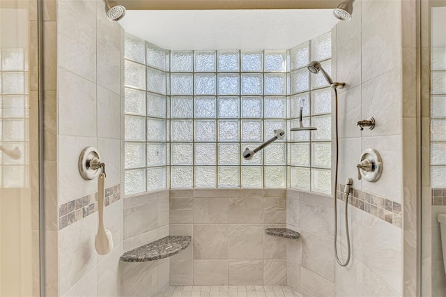 bathroom with a tile shower