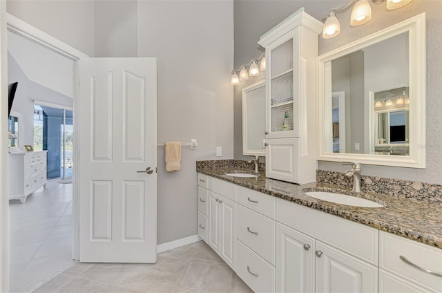 bathroom with vanity and tile patterned flooring