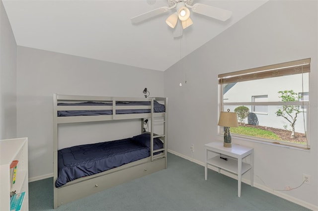 bedroom with vaulted ceiling, ceiling fan, and dark carpet