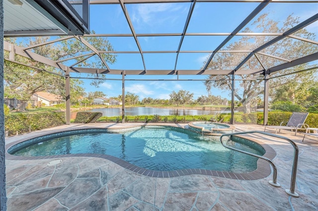 view of swimming pool featuring an in ground hot tub, a water view, a lanai, and a patio area