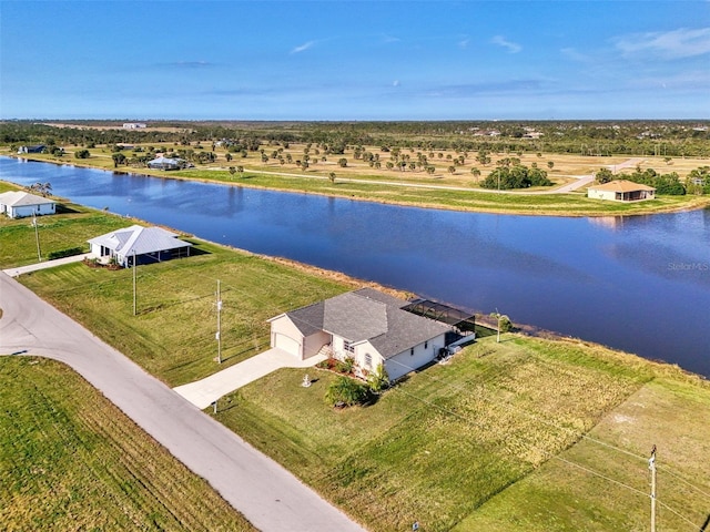 drone / aerial view with a water view