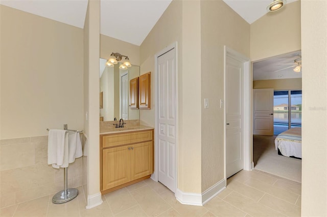 bathroom featuring vanity, tile patterned floors, and ceiling fan