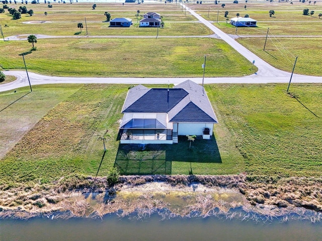 drone / aerial view featuring a rural view and a water view