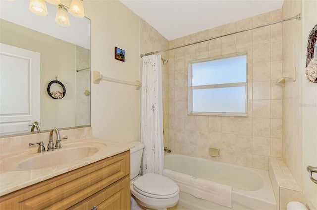 bathroom with shower / tub combo with curtain, vanity, and toilet