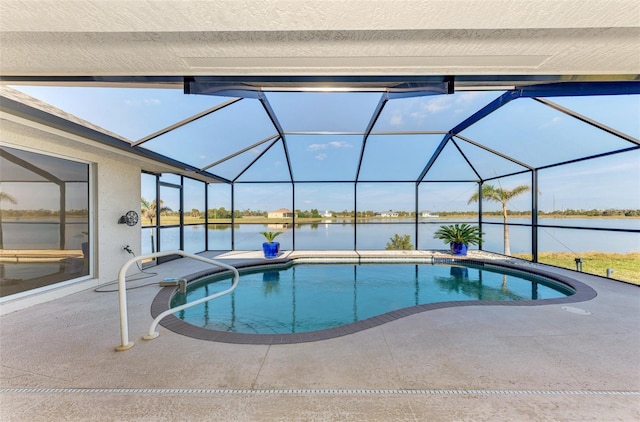 pool featuring a lanai, a patio area, and a water view