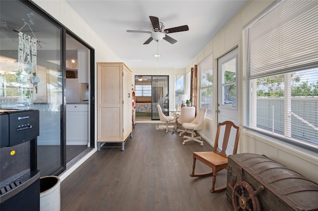 sunroom / solarium featuring ceiling fan