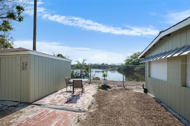 view of patio with a water view