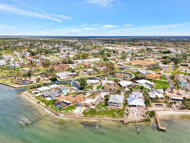 drone / aerial view featuring a water view and a residential view