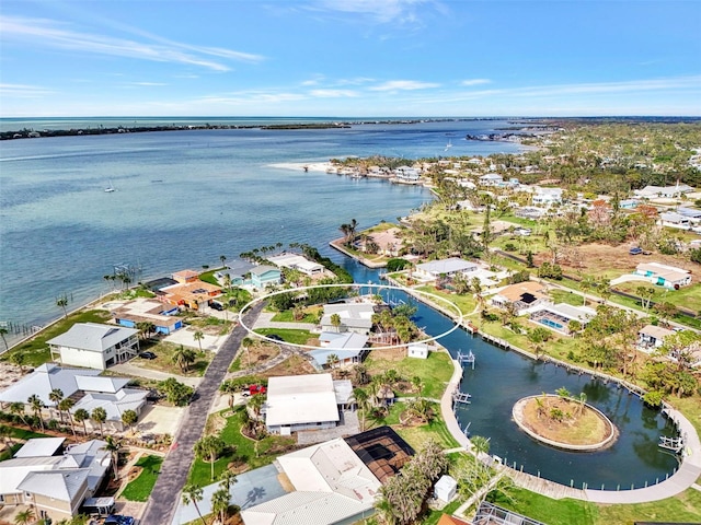 drone / aerial view featuring a water view and a residential view