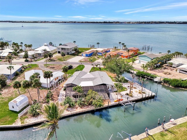 birds eye view of property featuring a residential view and a water view