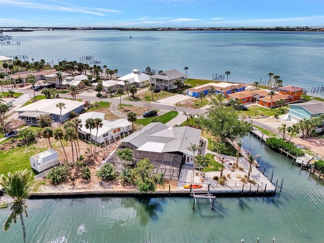 drone / aerial view with a residential view and a water view