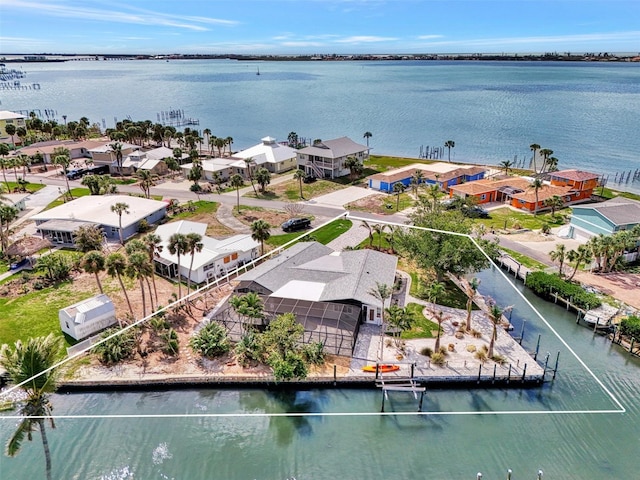 bird's eye view featuring a water view and a residential view