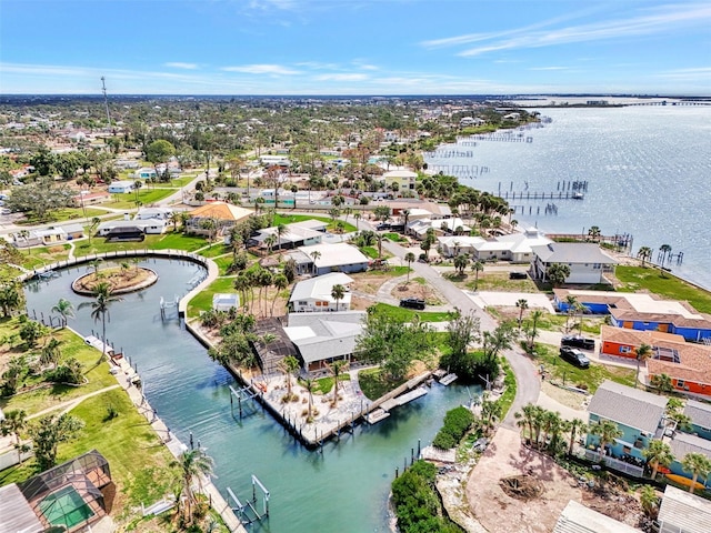 drone / aerial view with a residential view and a water view