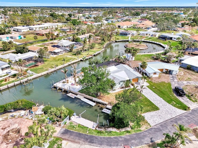 bird's eye view with a water view and a residential view