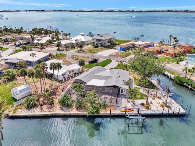 bird's eye view with a water view and a residential view