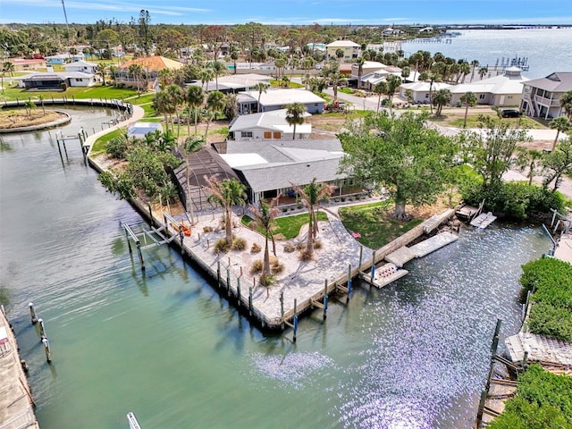 birds eye view of property with a residential view and a water view