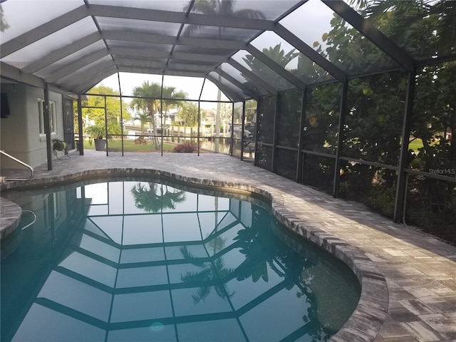 pool with a patio and a lanai