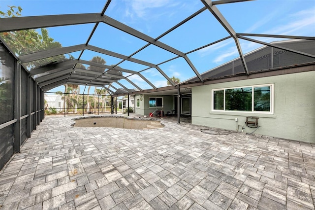 view of patio with a lanai