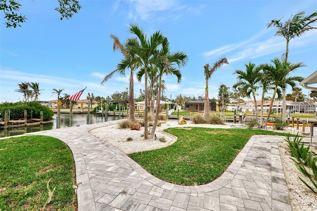 view of yard with a water view and a residential view