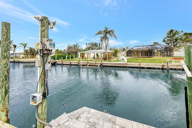 dock area with a water view and a lanai