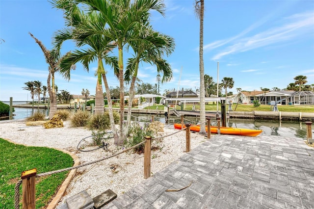 dock area featuring a residential view, a water view, and boat lift