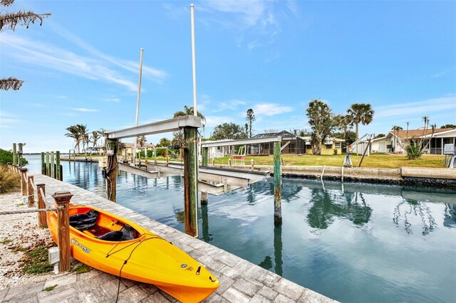 dock area featuring a water view and boat lift