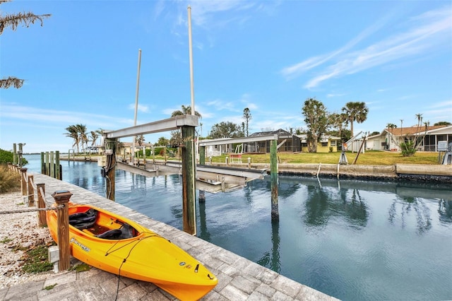 dock area featuring a water view and boat lift