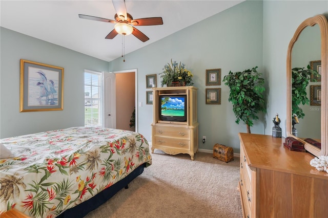 bedroom featuring ceiling fan, vaulted ceiling, and carpet