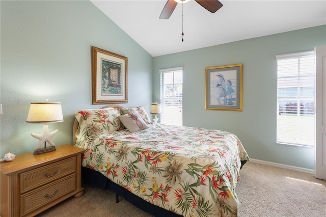 bedroom featuring light carpet, vaulted ceiling, and ceiling fan