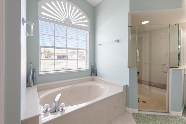 bathroom featuring tile patterned floors and plus walk in shower