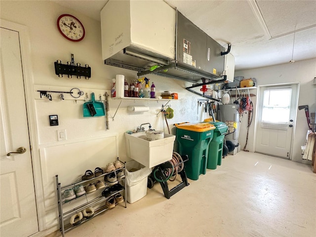 interior space featuring water heater and sink